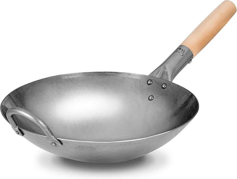 Perché scegliere un wok in acciaio di carbonio per cucinare 1 un wok di acciaio di carbonio in uso